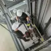 workers-installing-elevator