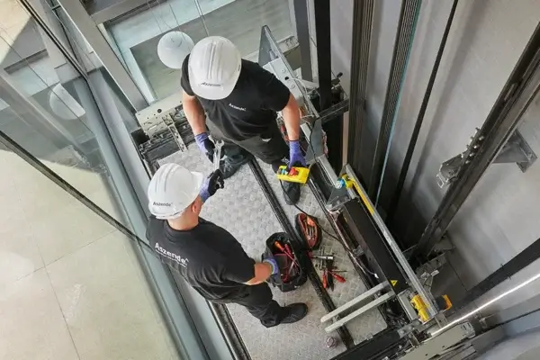 workers-installing-elevator