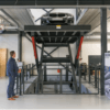 man-standing-in-front-of-car-elevator